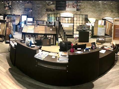 Store interior showcasing several different types of window coverings